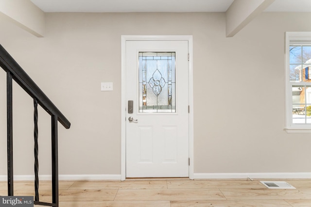 foyer with light hardwood / wood-style flooring