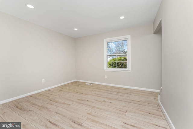 unfurnished room featuring light wood-type flooring