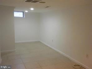 basement featuring visible vents and baseboards