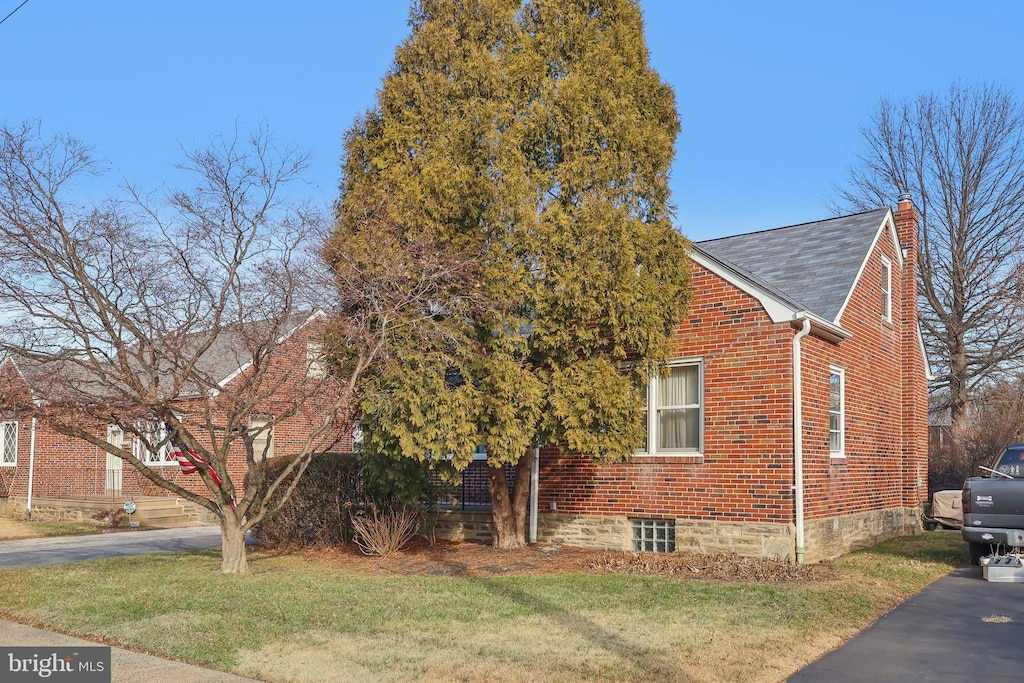 view of property exterior featuring a yard