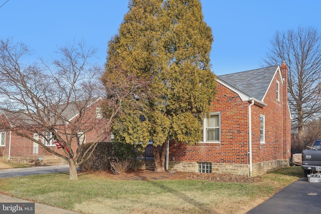 view of property exterior featuring a yard