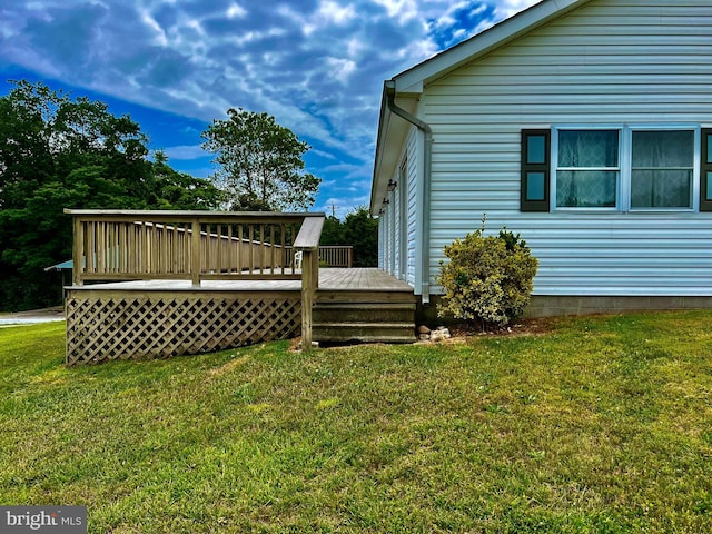 view of yard with a wooden deck