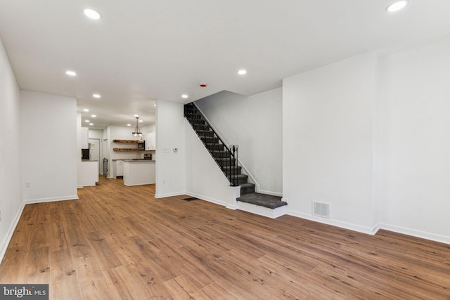 unfurnished living room with light hardwood / wood-style floors