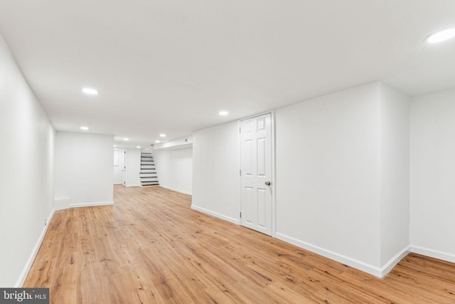 basement featuring light hardwood / wood-style flooring