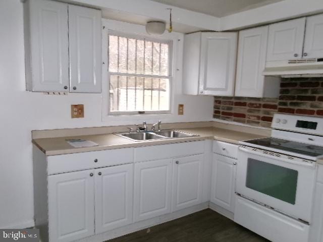 kitchen with white range with electric stovetop, white cabinetry, and sink