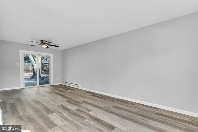 empty room featuring ceiling fan, light hardwood / wood-style floors, and baseboard heating