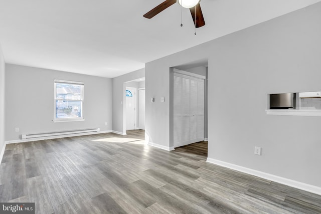 unfurnished living room featuring ceiling fan, light wood-type flooring, and a baseboard heating unit