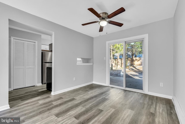 unfurnished room with ceiling fan and light hardwood / wood-style floors