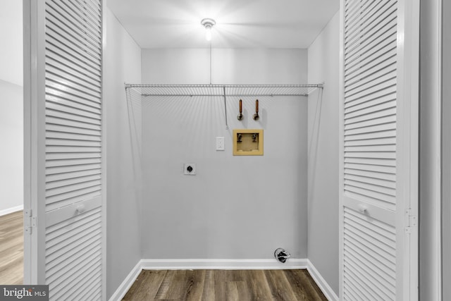 laundry room featuring hookup for a washing machine, hardwood / wood-style flooring, and electric dryer hookup