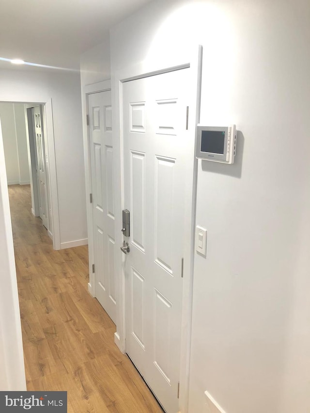 hallway featuring light hardwood / wood-style floors