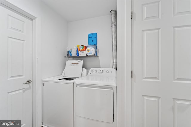 laundry area with laundry area and washer and dryer