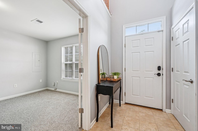 foyer featuring light tile patterned floors