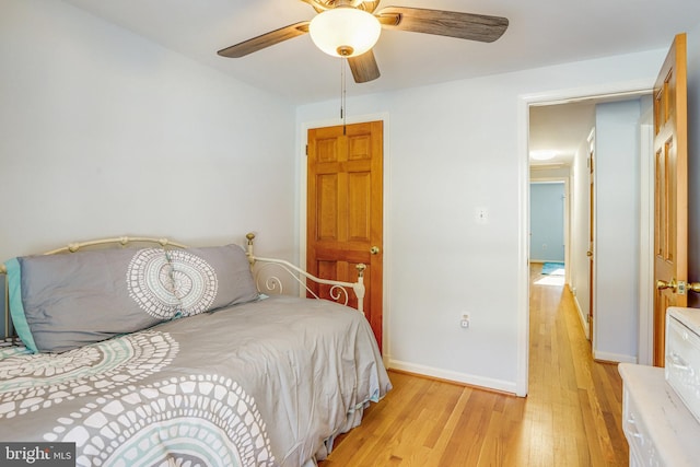 bedroom featuring light hardwood / wood-style floors and ceiling fan