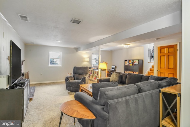 living room with light colored carpet and a textured ceiling