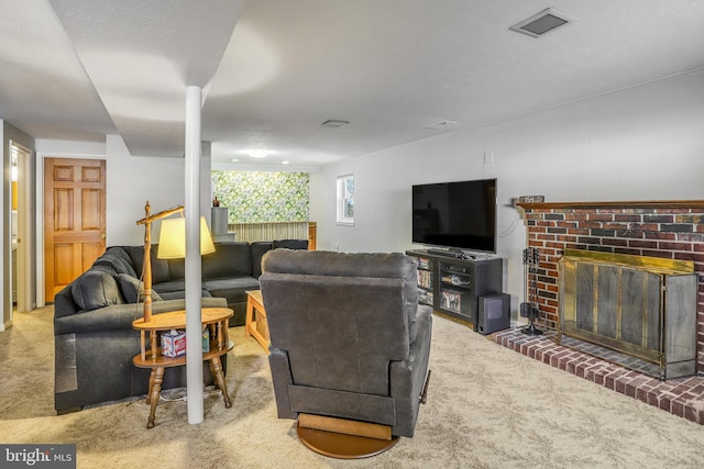 living room featuring carpet flooring and a brick fireplace