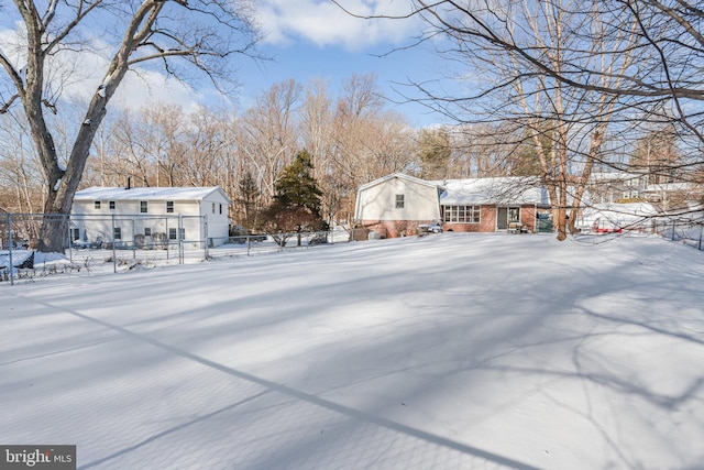 view of yard layered in snow