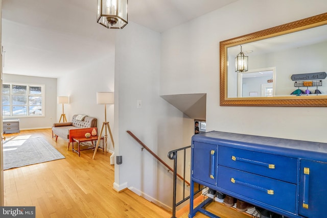 stairs with hardwood / wood-style floors