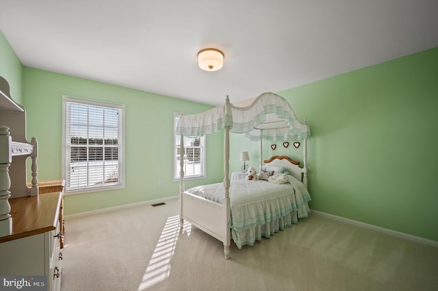 bedroom featuring light carpet