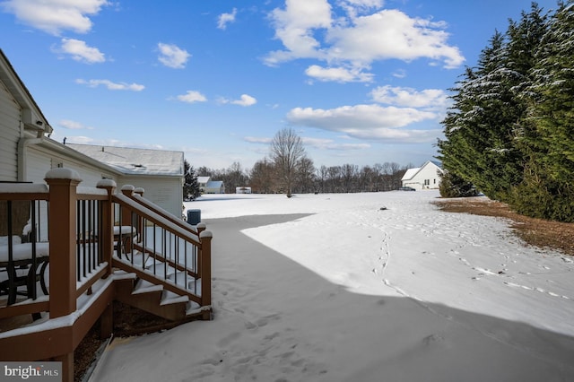 view of yard layered in snow