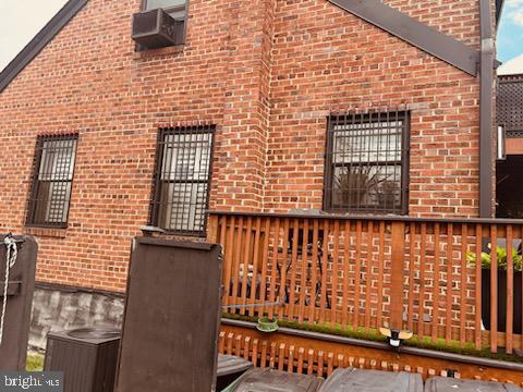 view of property exterior featuring a deck and cooling unit