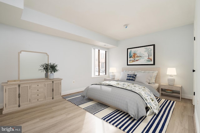 bedroom with light wood-type flooring