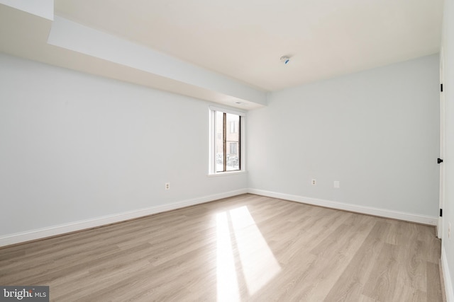 unfurnished room with light hardwood / wood-style floors