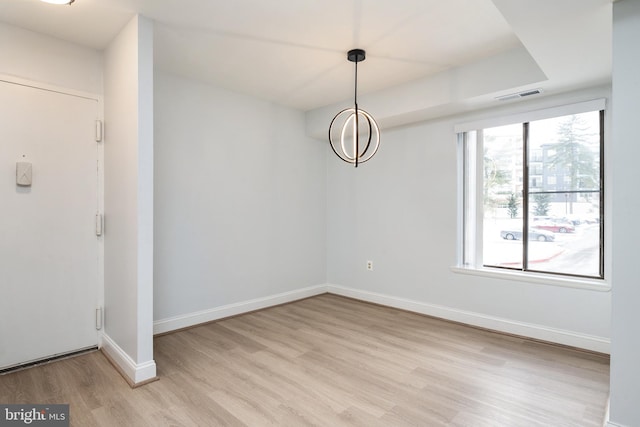 unfurnished dining area featuring light hardwood / wood-style flooring