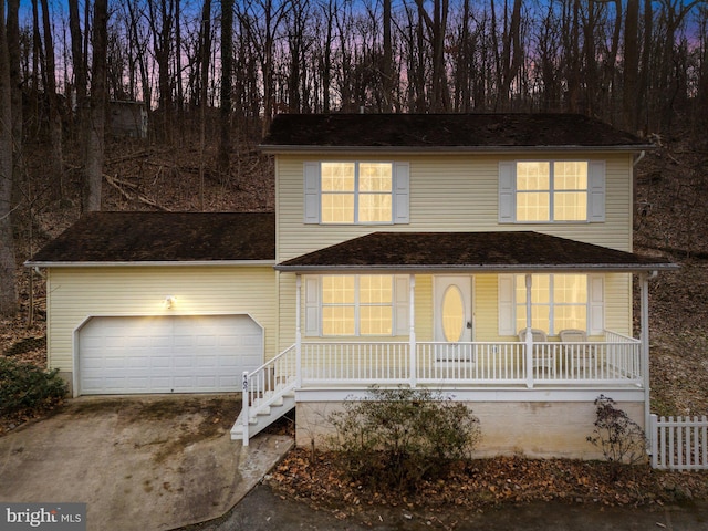 front facade featuring a garage and a porch