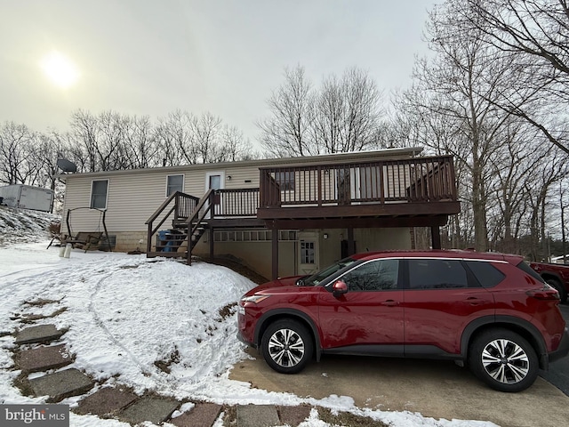 view of front of house featuring a wooden deck