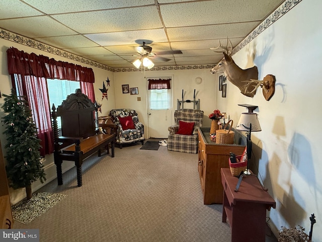 misc room with carpet, a paneled ceiling, and ceiling fan