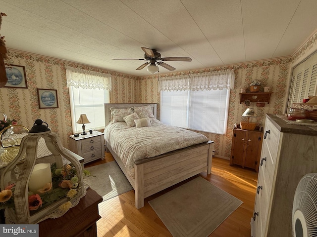 bedroom featuring light hardwood / wood-style floors and ceiling fan