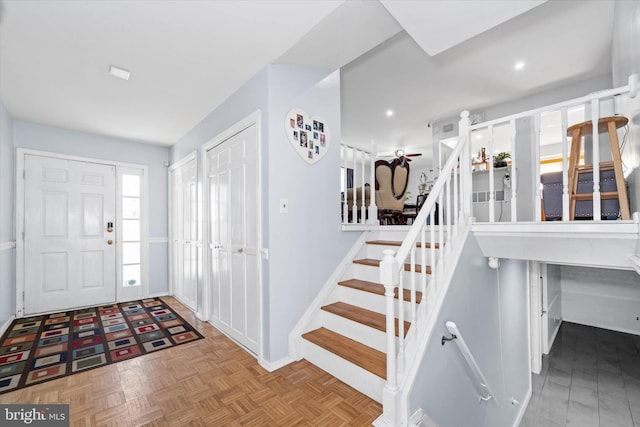 foyer featuring light parquet flooring and ceiling fan