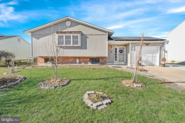 split level home featuring solar panels, a front yard, and a garage