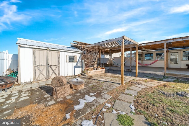 view of patio / terrace featuring a storage unit