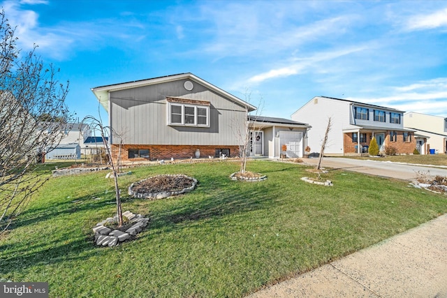 view of front of house with a garage and a front yard