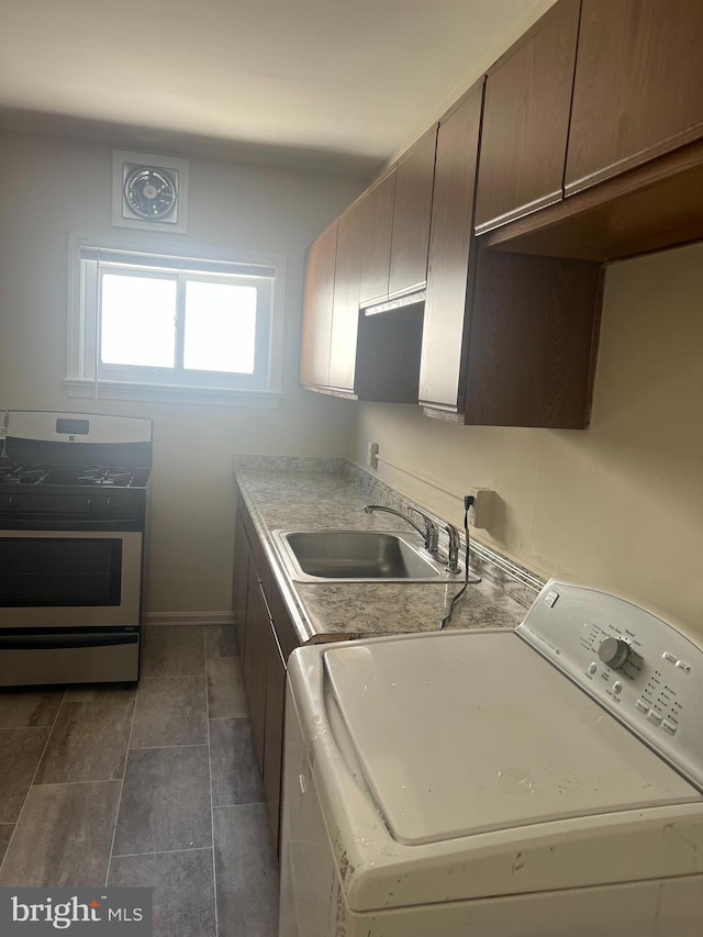 laundry room featuring washer / dryer and sink