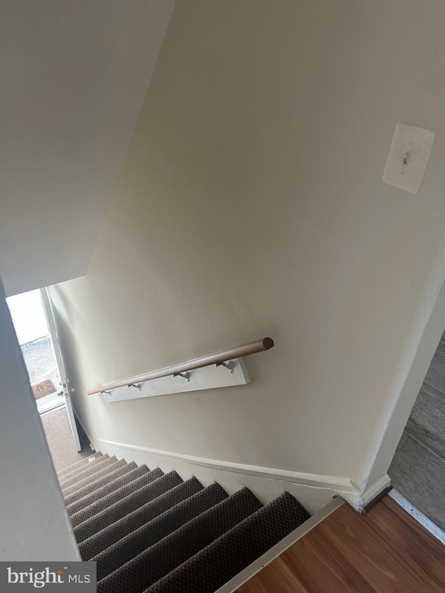 stairway with wood-type flooring