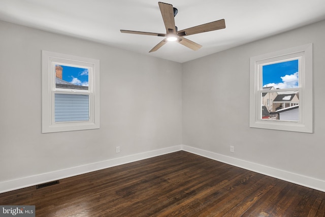 spare room featuring hardwood / wood-style floors and ceiling fan