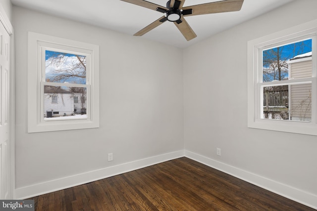 spare room with ceiling fan and wood-type flooring