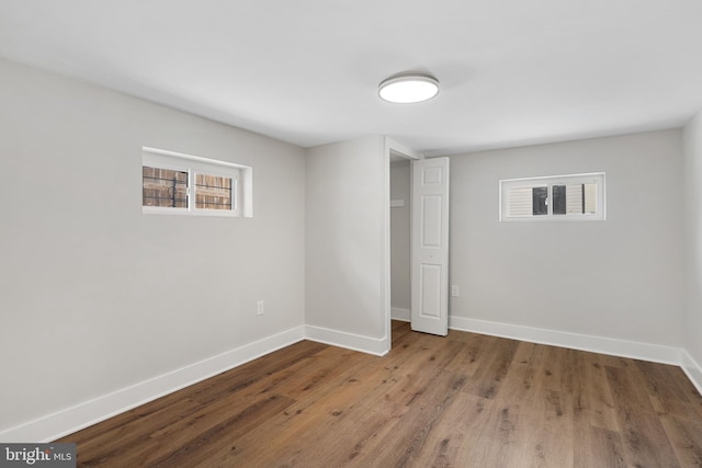 unfurnished bedroom with hardwood / wood-style flooring