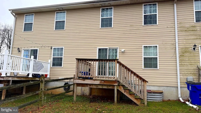 rear view of house featuring a deck