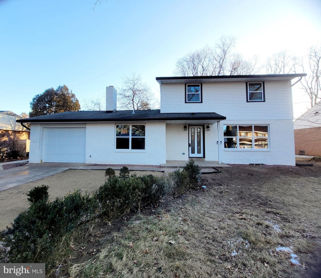 front of property with a garage