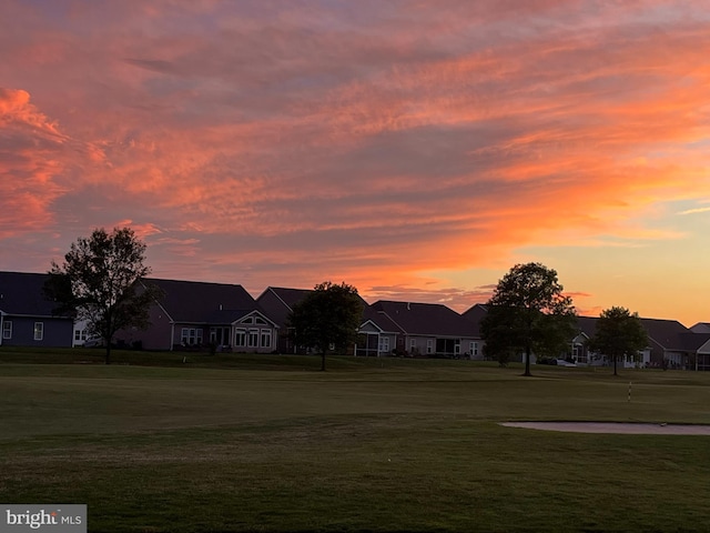 view of home's community featuring a lawn