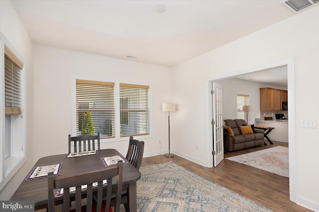 dining area with hardwood / wood-style flooring