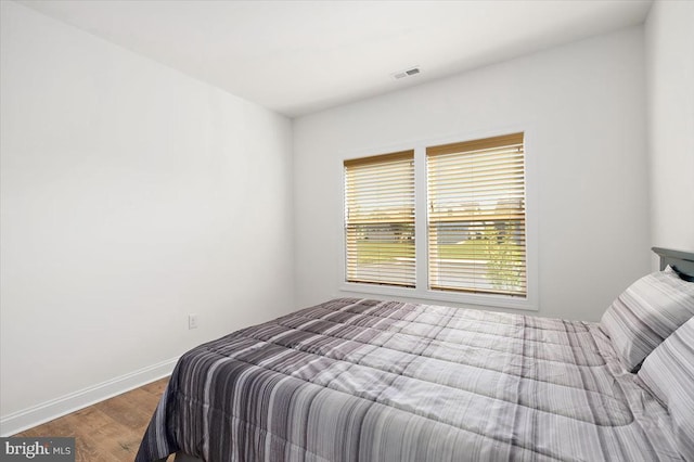 bedroom featuring hardwood / wood-style floors