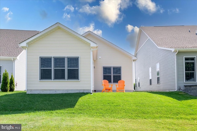 back of house with a yard