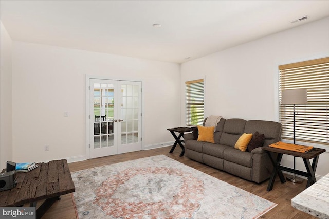 living room featuring french doors and hardwood / wood-style floors