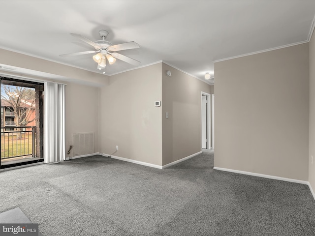 spare room featuring ceiling fan, carpet floors, and crown molding