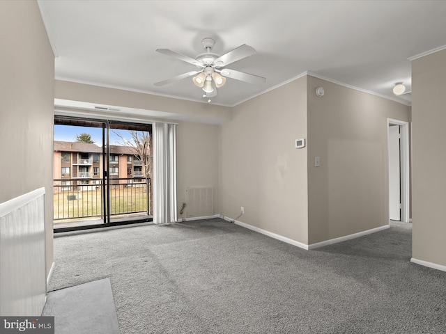 unfurnished room featuring ceiling fan, carpet, and ornamental molding