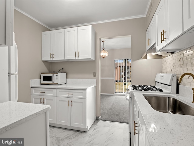 kitchen with light stone counters, white cabinets, hanging light fixtures, and white appliances